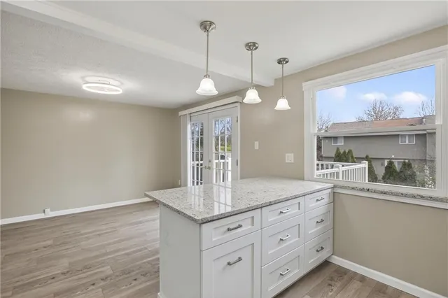 a view of a kitchen counter space and wooden floor