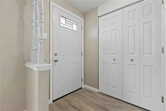 an empty room with wooden floor