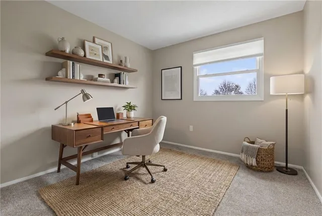 a view of a workspace with furniture
