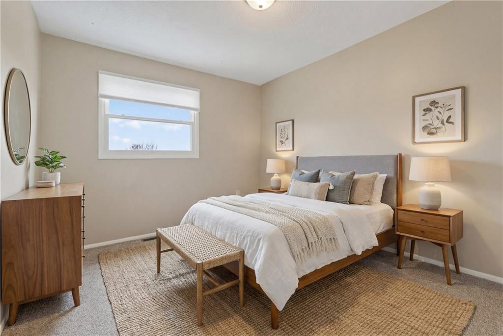 518 Hemlock Court Coraopolis, PA 15108 - Photo 26 of 34 a bedroom with a bed and wooden floor