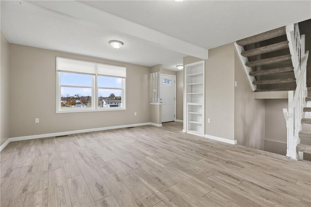 518 Hemlock Court Coraopolis, PA 15108 - Photo 5 of 34 an empty room with wooden floor closet and windows