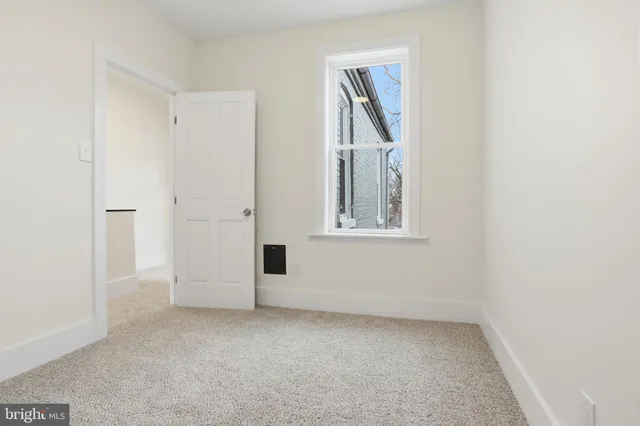 a view of empty room with windows