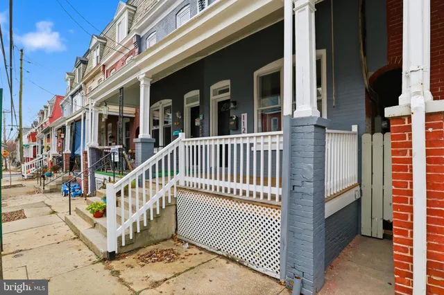 a view of a brick building with many windows