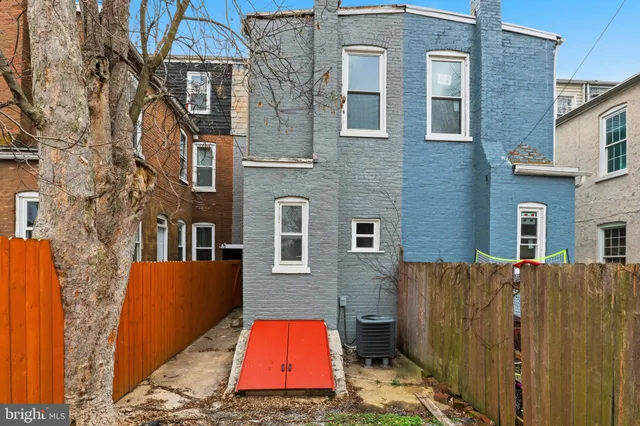 a backyard of a house with seating space