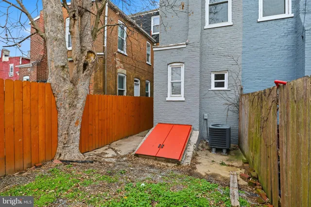 a picture of a room with a floor and a ceiling fan