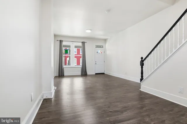 a view of an entryway with wooden floor