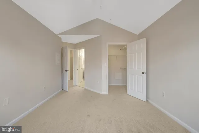 a view of an empty room and closet
