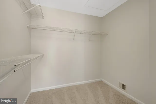 a living room with furniture a fireplace and a chandelier