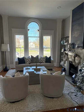 a living room with furniture and a fireplace