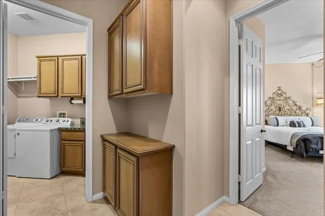 a view of hallway with washer and dryer