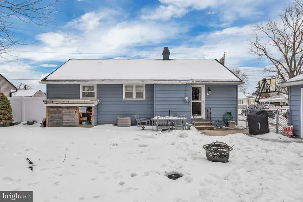a view of a house with snow on the road