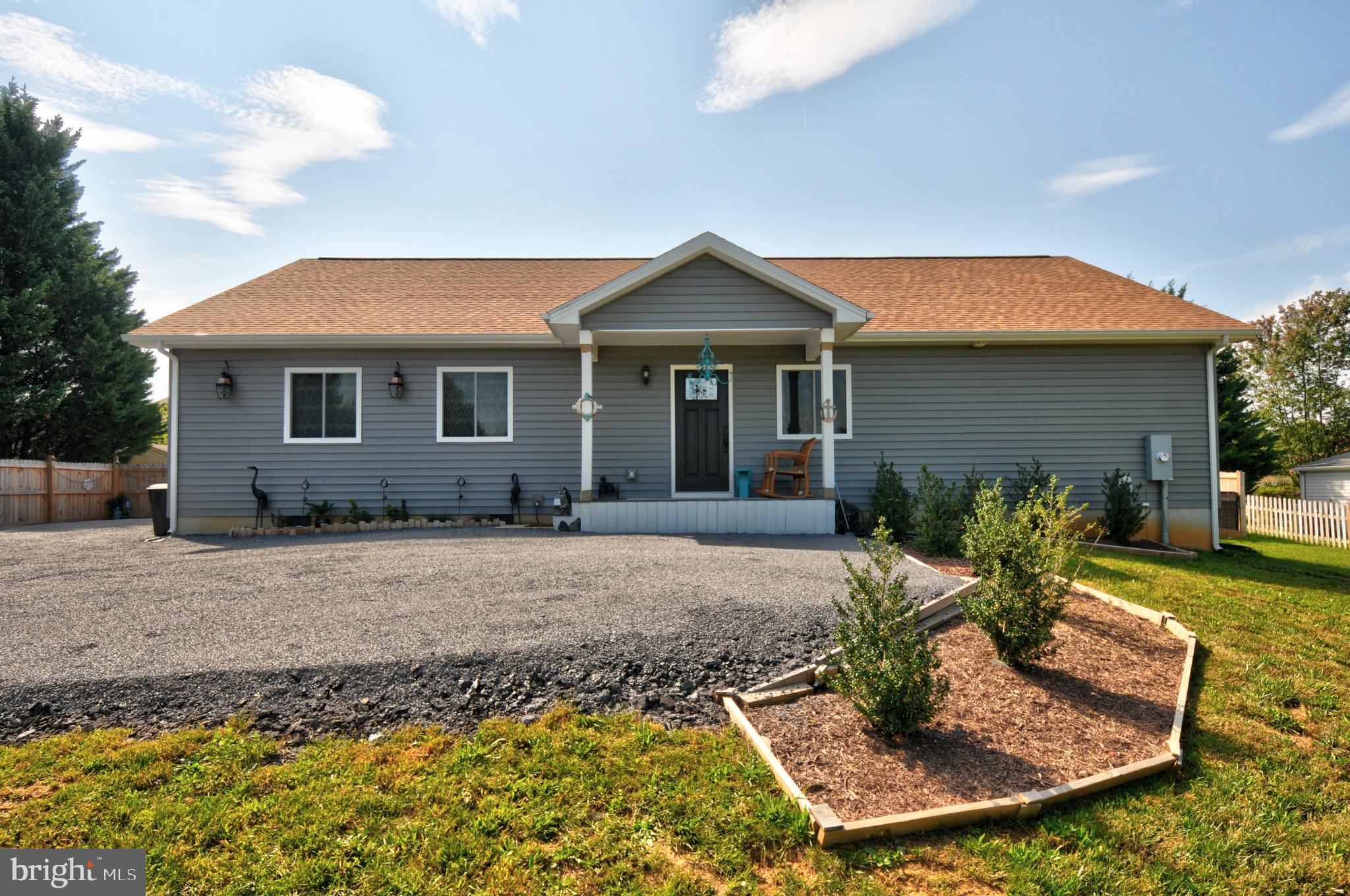 Front view of home with driveway.