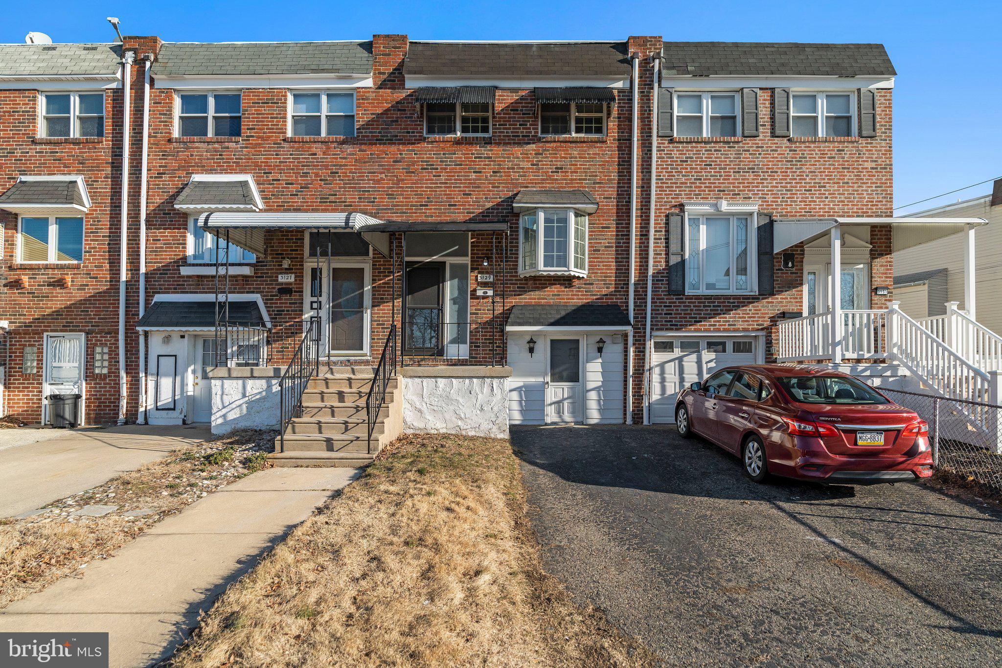 3129 Fairdale Road Philadelphia, PA 19154 - Photo 1 of 17 a front view of a house with cars parked