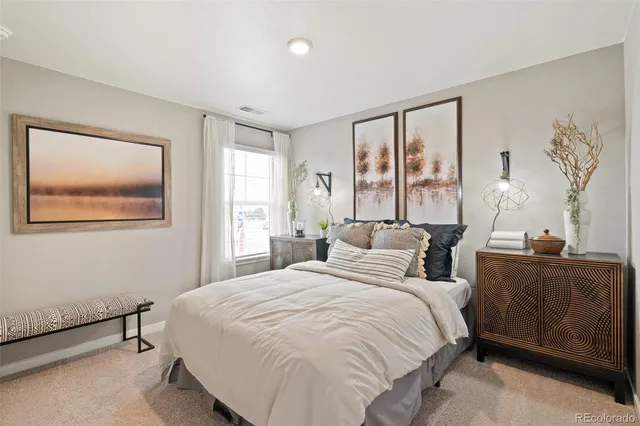 a bedroom with bed and window