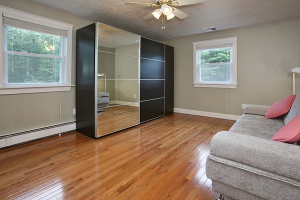 152 Littlefield Road Boxborough, MA 01719 - Photo 6 of 10 a spacious bedroom with a bed and a window