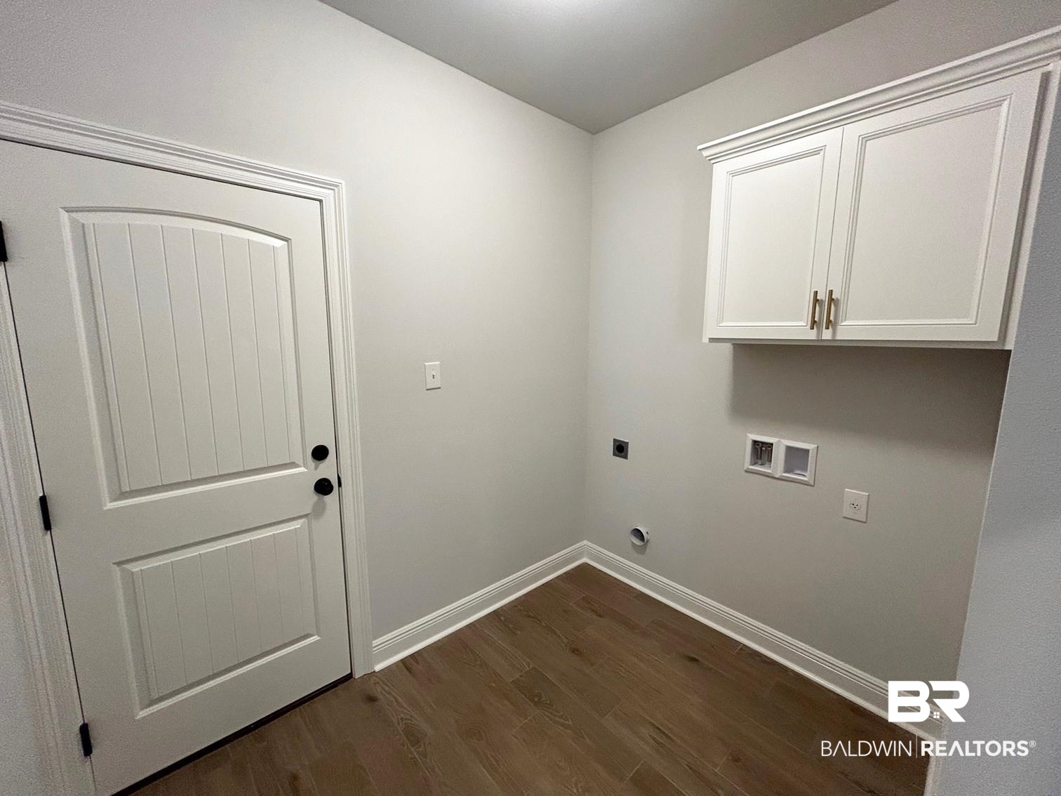 884 Sumter Loop Foley, AL 36535 - Photo 11 of 18 Clothes washing area featuring hookup for a washing machine, electric dryer hookup, cabinets, and dark hardwood / wood-style flooring