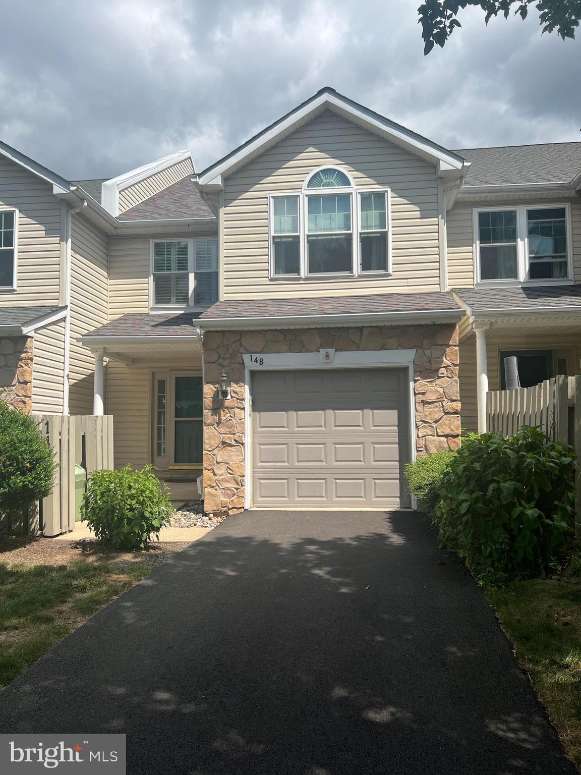 148 Galway Circle Chalfont, PA 18914 - Photo 1 of 23 a front view of a house with a yard and garage