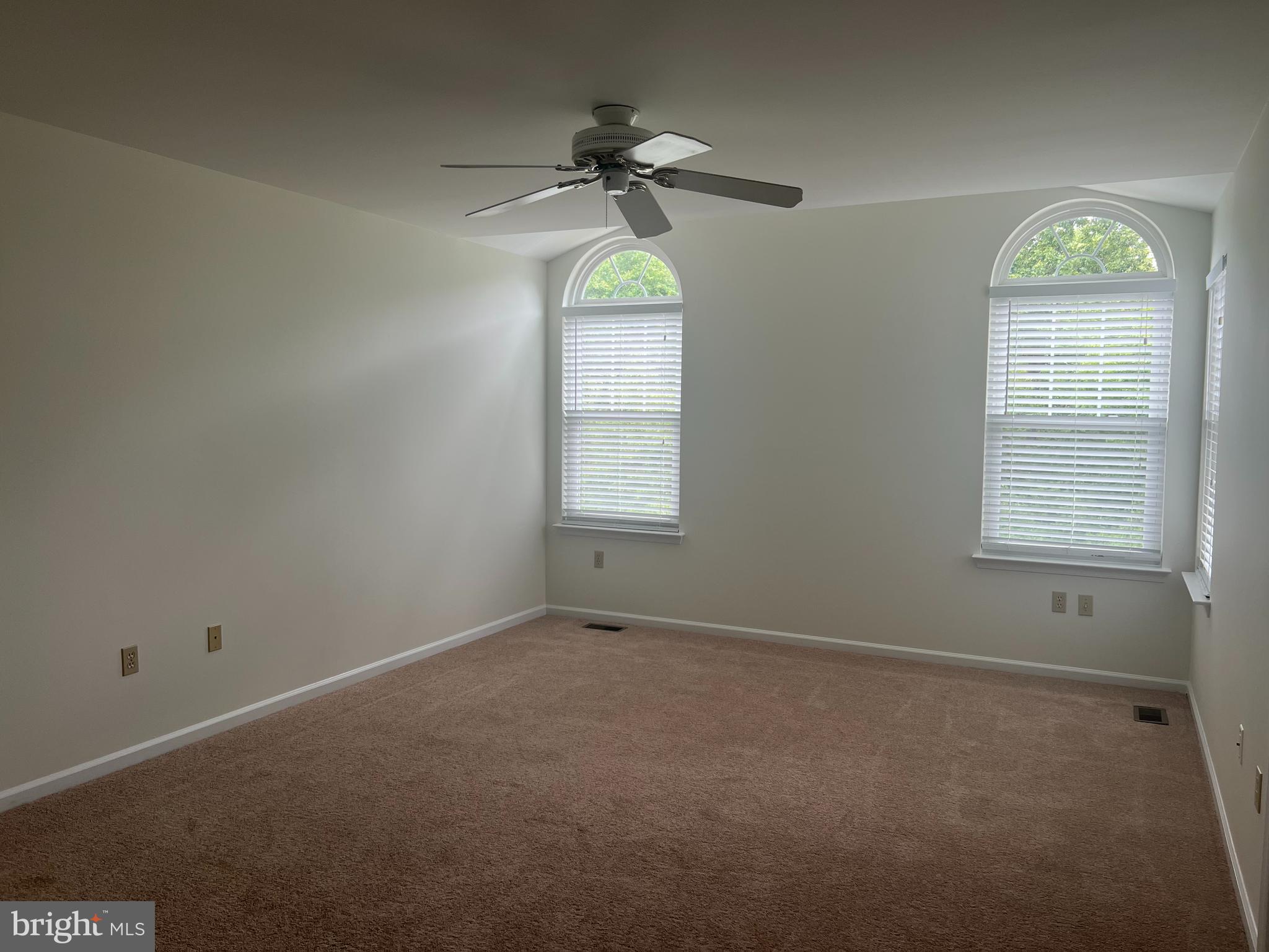148 Galway Circle Chalfont, PA 18914 - Photo 13 of 23 an empty room with a window and a chandelier fan