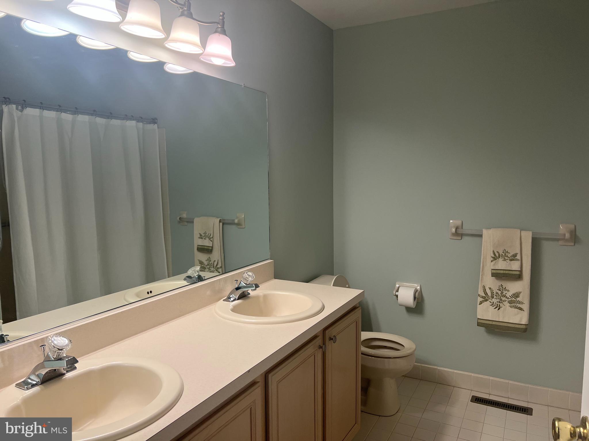 148 Galway Circle Chalfont, PA 18914 - Photo 15 of 23 a bathroom with a sink vanity mirror and toilet
