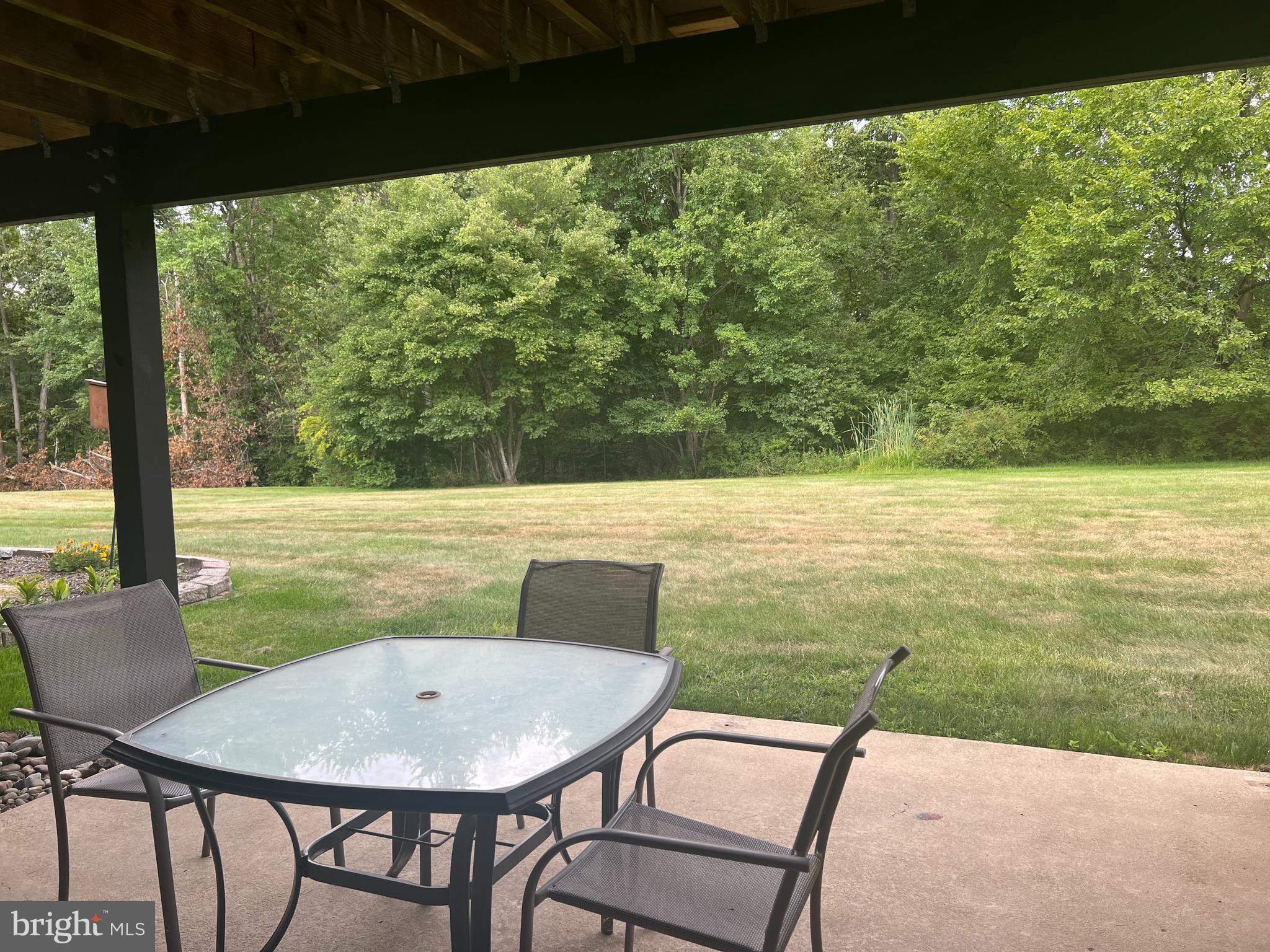 148 Galway Circle Chalfont, PA 18914 - Photo 20 of 23 a view of a chairs and table in patio with a lake view