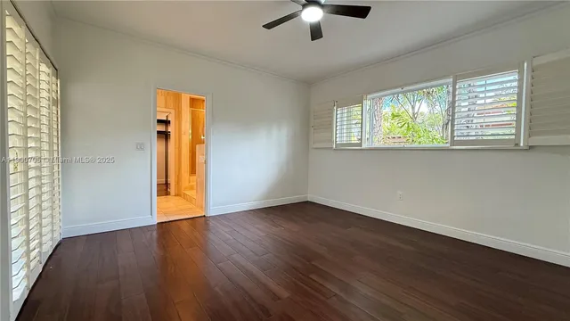 a view of hallway with stairs and furniture