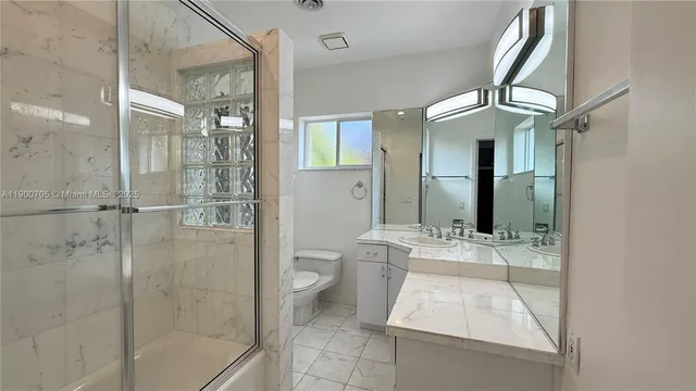a view of a sink a washer and dryer