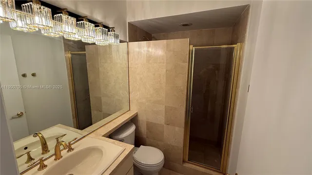 a view of an entryway with wooden floor and a livingroom