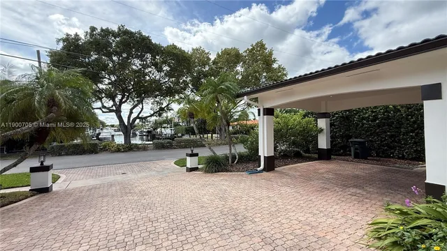 a view of a chair and tables in the patio