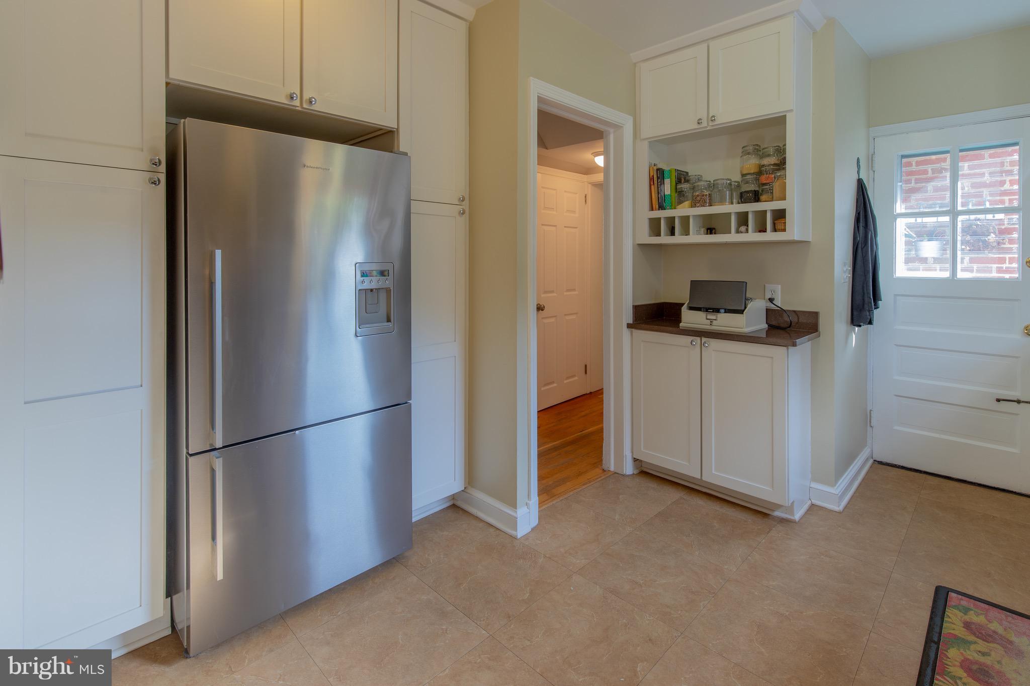 9522 Saybrook Avenue Silver Spring, MD 20901 - Photo 7 of 29 a kitchen with stainless steel appliances a refrigerator a sink a stove and cabinets