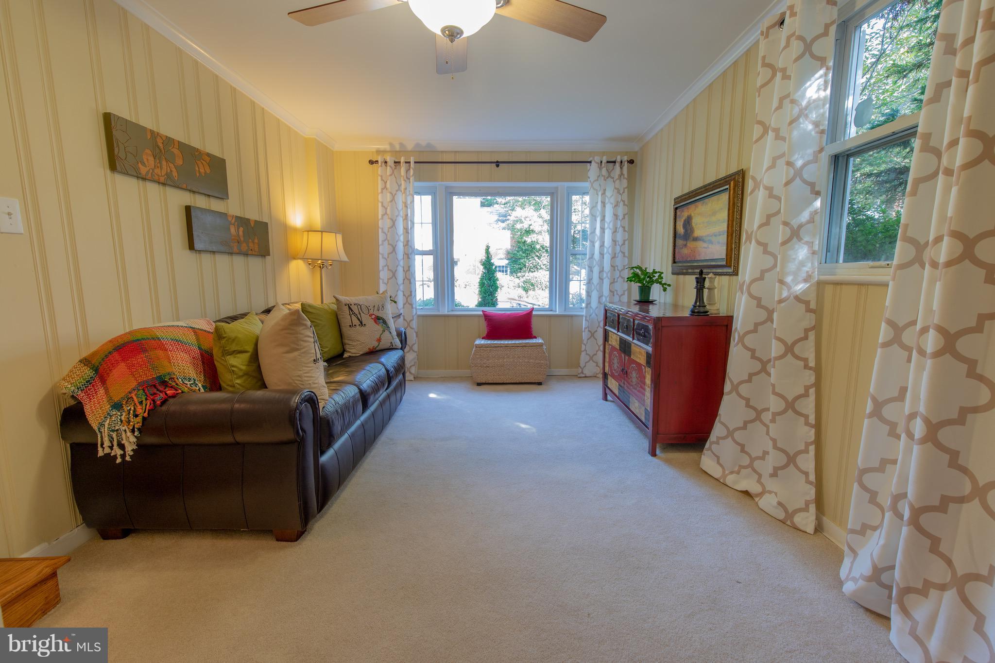 9522 Saybrook Avenue Silver Spring, MD 20901 - Photo 9 of 29 a living room with furniture and a large window