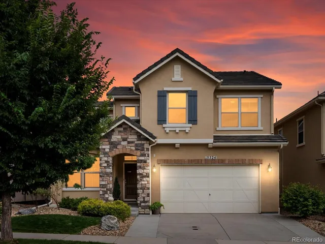 a front view of a house with garage