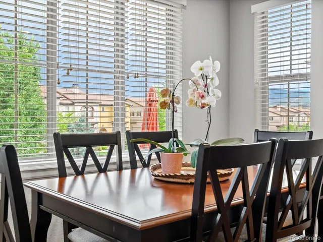 a dining room with furniture and window