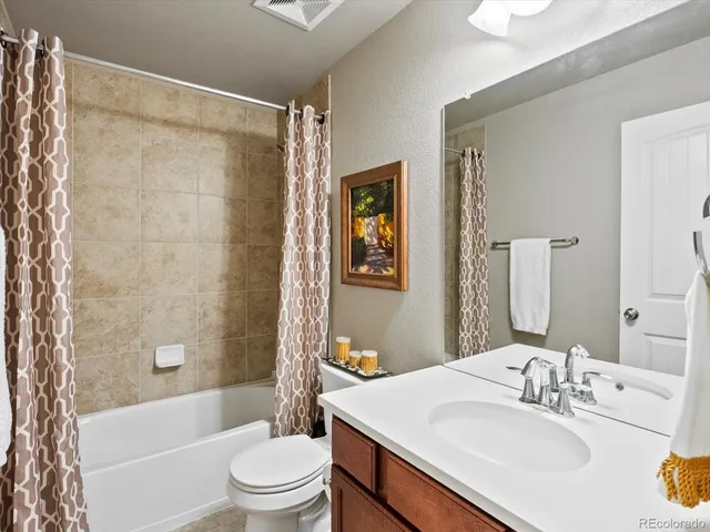 a bathroom with a sink a toilet and a bathtub