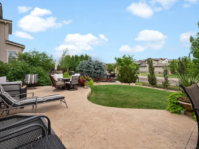 a view of a dining table and chairs in patio