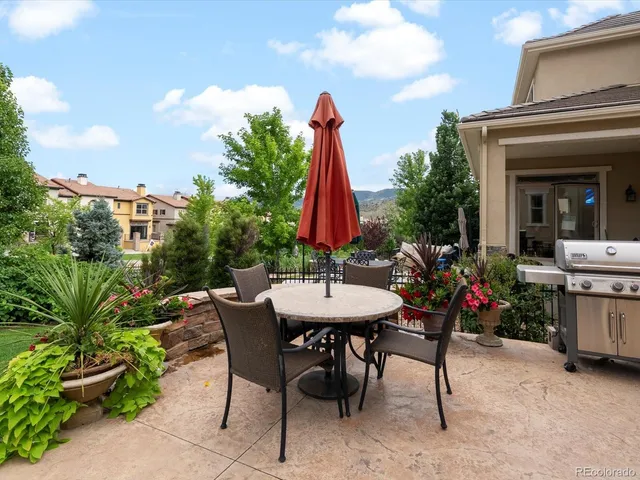 a view of a patio with fire pit