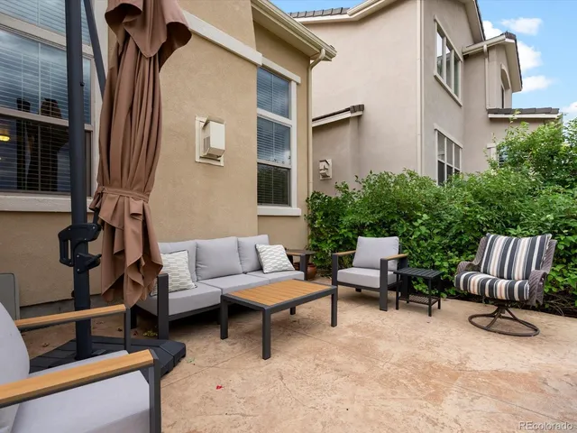 a view of a patio in backyard