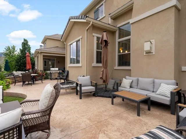 a view of a garden with a building in the background