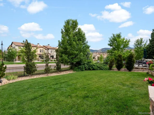 a view of a patio with table and chairs and potted plants