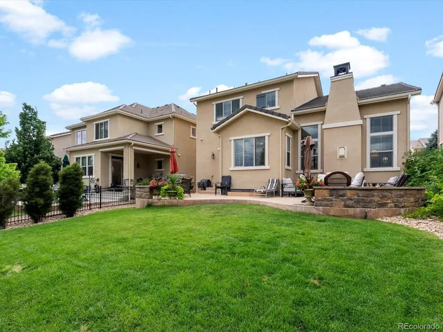 a view of a chairs with a table in the patio