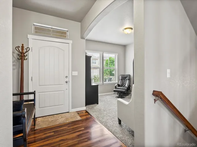 a hallway with a view of living room