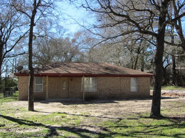 a house with trees in front of it