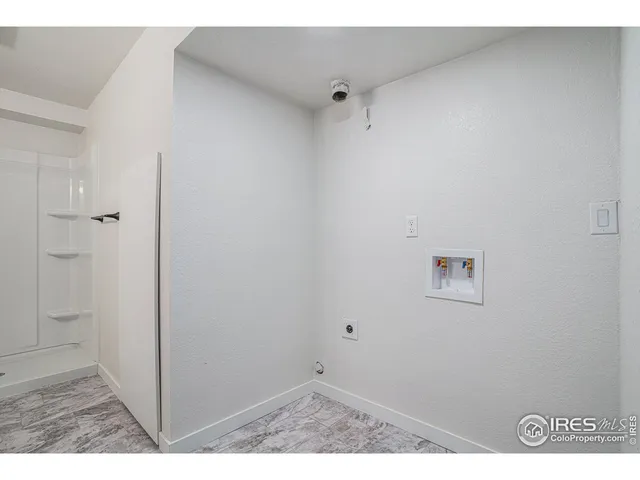 a bathroom with a sink mirror and toilet