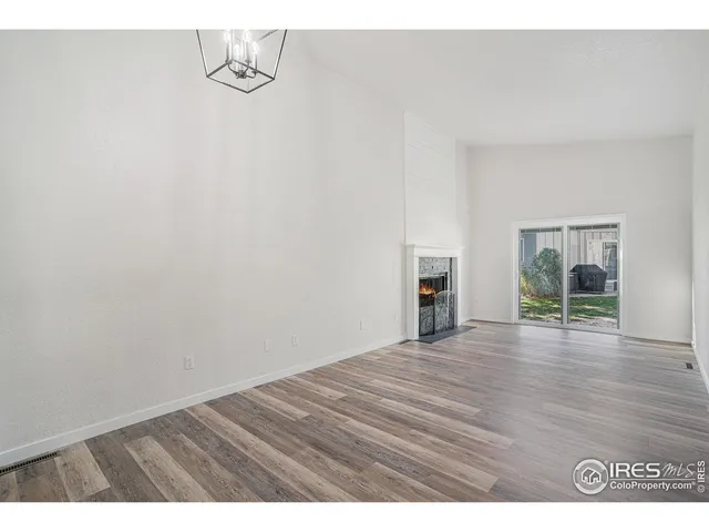a view of a livingroom with wooden floor