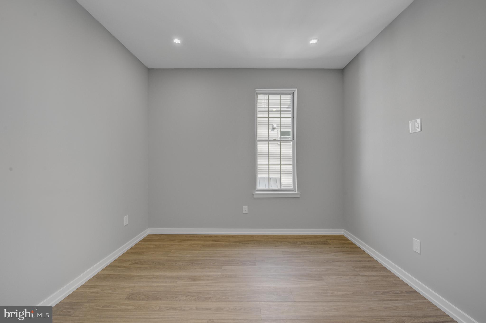 2445 Innovator Way, Unit 3D Philadelphia, PA 19146 - Photo 9 of 19 wooden floor in an empty room with a window
