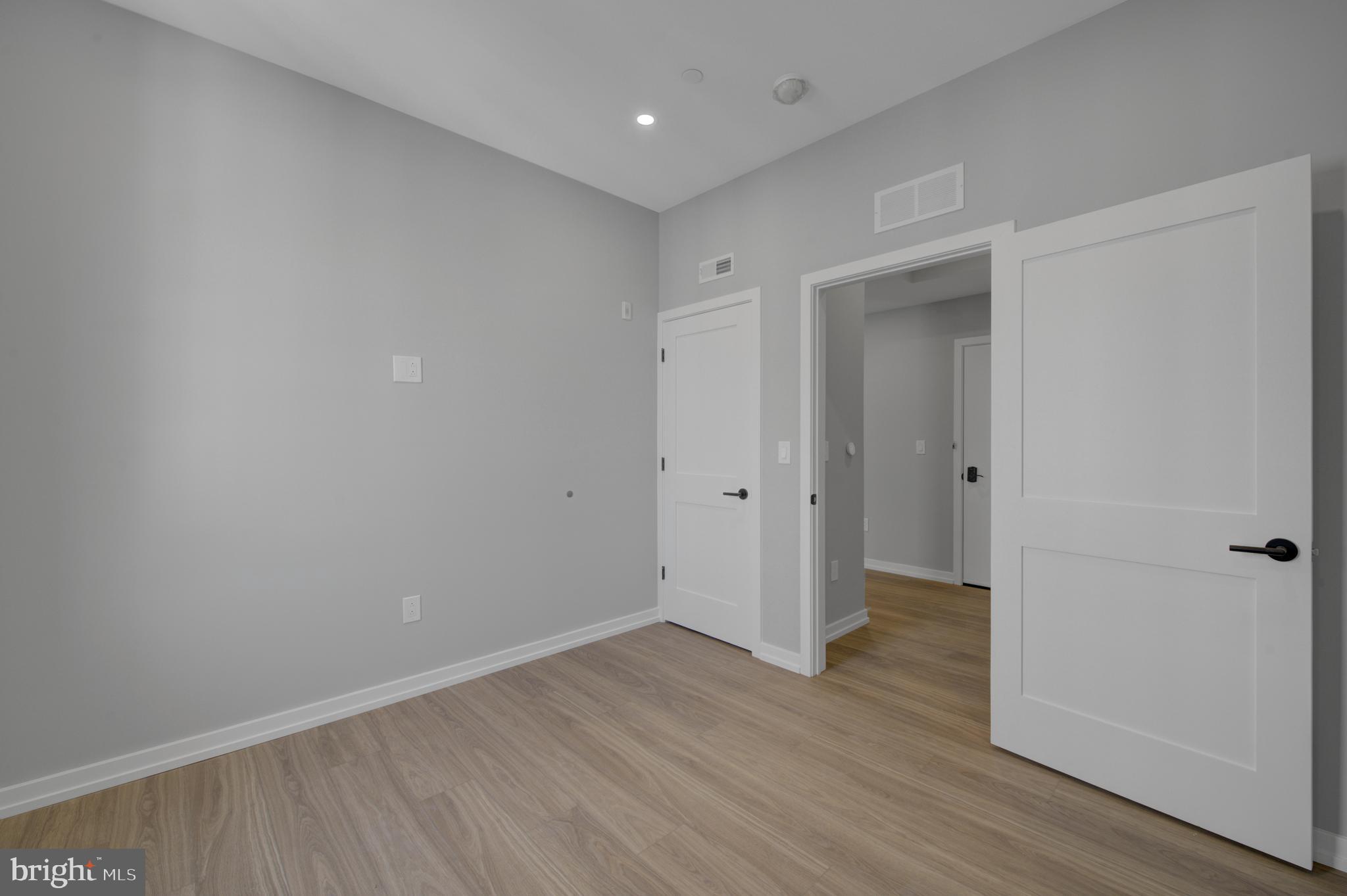 2445 Innovator Way, Unit 3D Philadelphia, PA 19146 - Photo 10 of 19 a view of an empty room with wooden floor