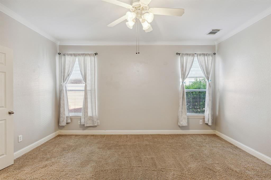 3370 Nation Drive Frisco, TX 75034 - Photo 14 of 37 an empty room with windows and chandelier fan