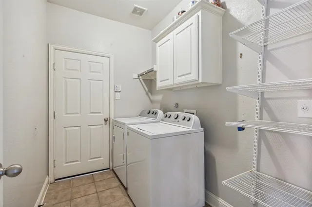 a view of storage and utility room with washer and dryer