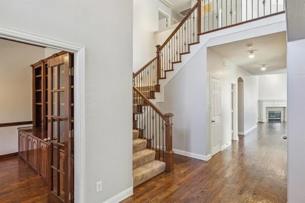 a view of entryway with wooden floor and stairs