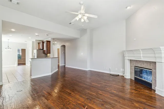 a view of a kitchen with a sink and a fireplace
