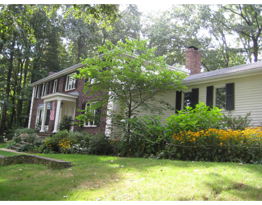 2 Abbott Road Maynard, MA 01754 - Photo 1 of 26 a front view of house with yard and green space